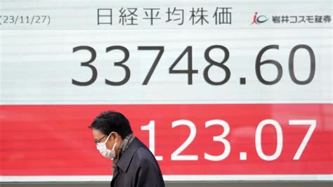 Stock market today: Asian shares mostly decline, as investors watch spending, inflation